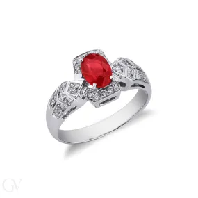 Anello in oro bianco 18k con rubino centrale ovale e diamanti